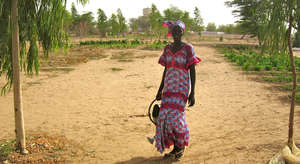 Women currently water crops by hand