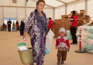 A family receiving their hygiene kit