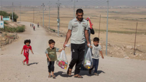 A family with the supplies they have received