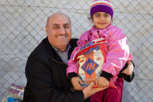 Father and Daughter receiving a food pack