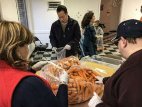 Sorting 50 pounds of carrots for the food shelter