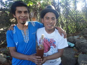 Jeremias and Giovanni selling honey