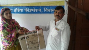 Somni receiving sewing machine from Parvez AIF