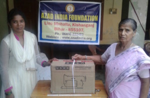 Anjuma  receiving machine from AIF Chairperson