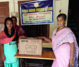 Pyari receiving her machine from AIF Chairperson