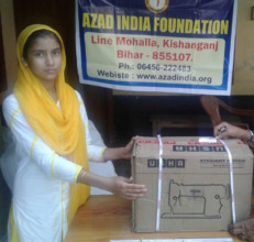 Razia with her sewing machine