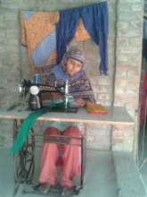 Hasina working at her home