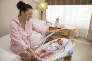 Mother observes her baby's painless screening test