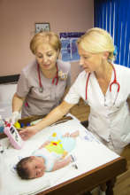 Two Nurses Screen Baby for Heart Defects