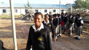 Lucy enters her exam with a smile