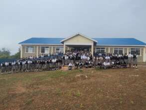 Principal and students in front of new library