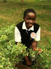 Purity enjoys spending time in the school garden.