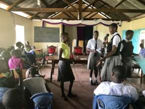 Josephine leads an SRH workshop for younger girls