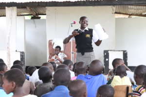 Debora proudly leads SRH outreach in a church