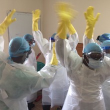 Hospital staff learning to use PPE