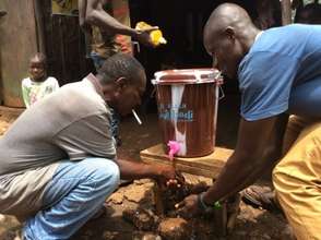 Men using the new hand washing station