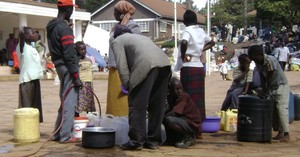 GEMINI photo-- families wait for water