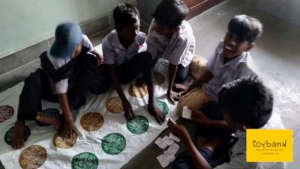 Children playing twister creatively using chits!