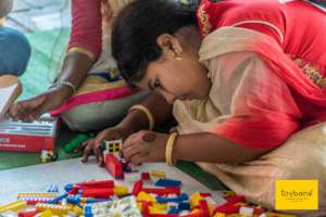 Focused & determined playing Building Blocks!