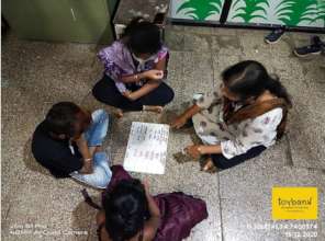 Teacher guides children about wet and dry waste