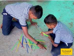Children playing the game of Mikado