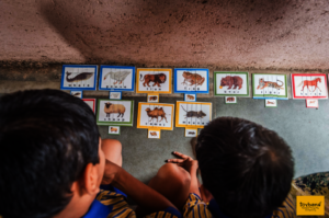 Children learning word building through puzzles