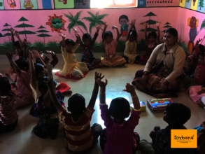 Children being taught through Play by a Teacher
