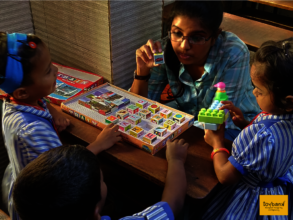 Our program officer teaching alphabet blocks