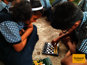 Children playing chess during a play session