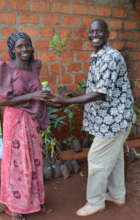 Uganda Program Director Edward distributing trees