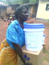 An excited woman carrying her purifier home