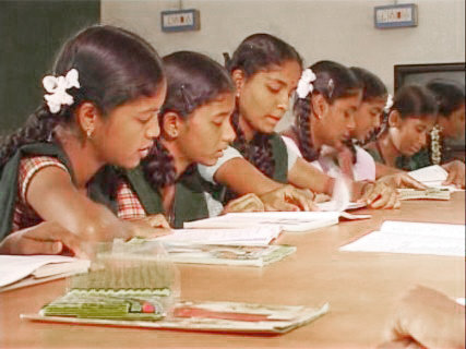 Children reading books from the Bread Library