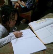 My daughter with her school assignments