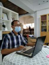 At the office working on the annual tax report