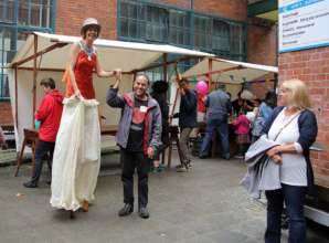 one mentor walking on stilts