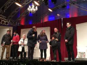 Mentor and mentee on the stage at christmas market