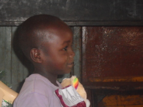 Rescued child with a Christmas gift
