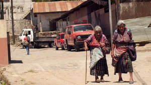 Elderly walking to our feeding center