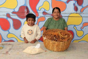 Rolando receiving chickens with Maria
