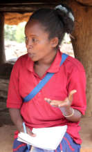 Azeb speaking with a household on hygiene