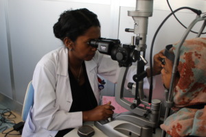 Dr. Bezawit conducting an eye examination