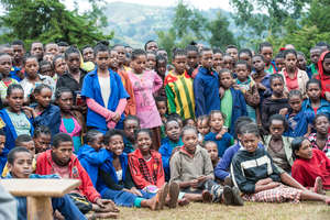 School children watch a play by the eye club