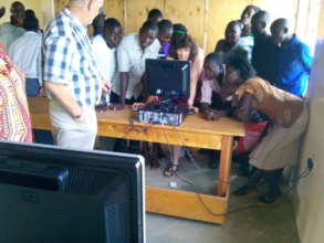 our donor and friend showing students  how to use