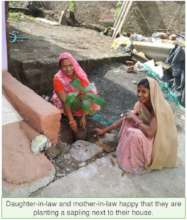 Women of a family planting together with smiles
