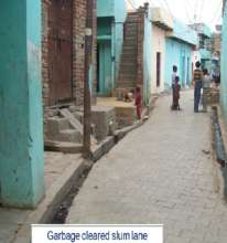 Slum lane looks neat after garbage is cleaned up
