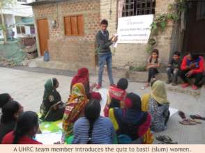A UHRC team member introduces quiz to women