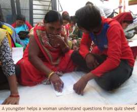 A youngster helping a woman understand questions