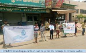Slum children spread messages through placards