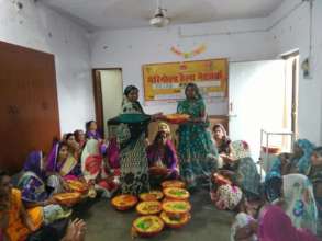 Lalita attending Baby Shower and community meeting