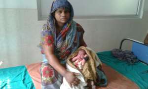 Happy mother with her healthy newborn